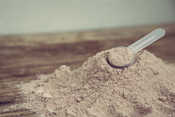 Double chocolate whey protein powder scoop nutrition healthy food bodybuilding.