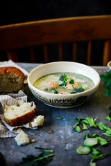 Broccoli  cream soup with salmon dumplings.selective focus