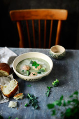 Broccoli  cream soup with salmon dumplings.selective focus