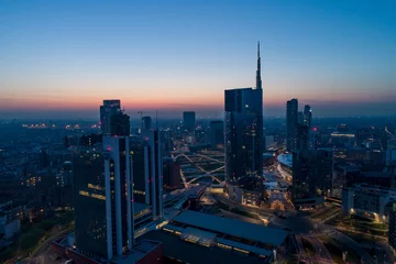 Printed kitchen splashbacks Milan Milan (Italy) city skyline at dawn, aerial view, flying over financial area skyscrapers in Porta Nuova district. Unicredit Tower office building at sunrise.