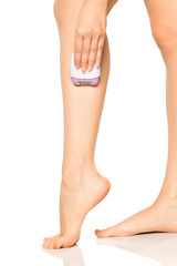 woman remove her leg hair with electric epilator on white background