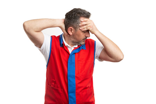 Supermarket Worker Touching Back Of Neck And Forehead As Pain Concept.