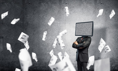 Businessman with TV instead of head.
