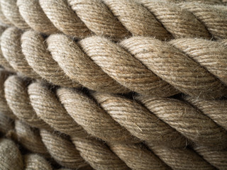 The thick rope twisted in a roll. A long rope for wide use