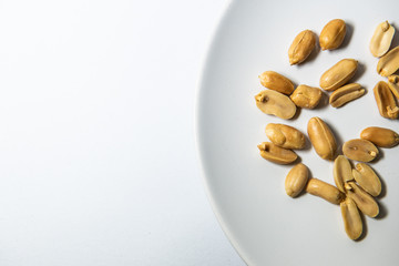 Nuts in white plate.
