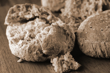 Freshly baked bread rolls. Toned monochrome close up image with rustic style.