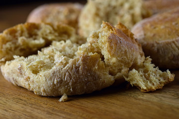 Fresh bread rolls on wooden table. Copy space