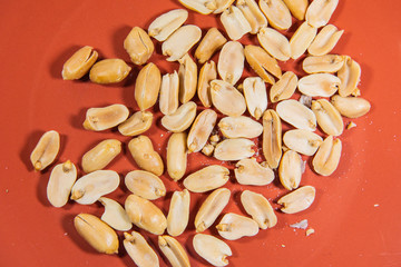 Nut in orange ceramic plate.
