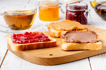 Delicious toast with sweet jam served for breakfast on table