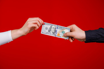 Hands giving money. Closeup. Transfer money from hand to hand.