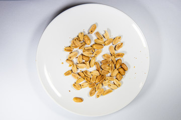 Nuts in white plate.