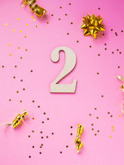 Number 2 celebration on star and glitter background