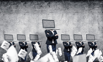 Business women with laptops instead of head.