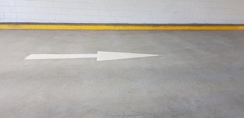 Road arrow pointing to right on concrete road