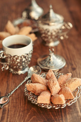 Turkish sweets with coffee on a wooden table