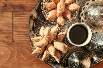 Turkish sweets with coffee on a wooden table