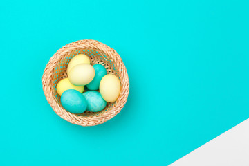 Fototapeta na wymiar Candy color easter eggs over bright paper background