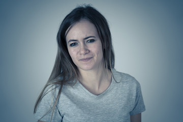 Fototapeta premium Human expressions and emotions. Moody female teenager with angry face looking furious