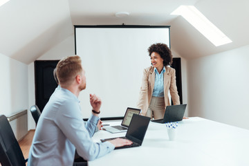 Business presentation in a modern bright meeting room.