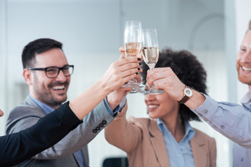 Celebrating business triumph, close-up.