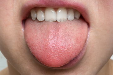 Obraz premium Woman with open mouth showing tongue