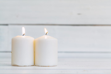 home lighting candles on wooden table