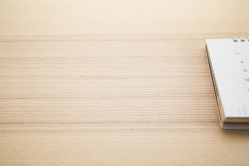 calendar page on wood table background