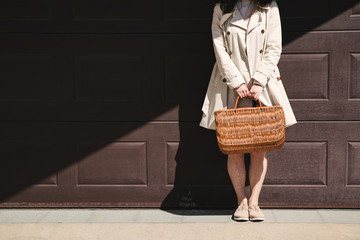 Girl walking with shopping bag in the street.