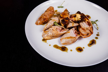 Naklejka premium Spicy chicken fillet baked with bacon, tomatoes and cheddar cheese
