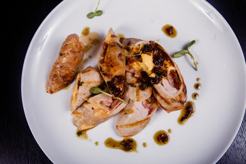 Spicy chicken fillet baked with bacon, tomatoes and cheddar cheese