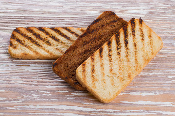 grilled bread on wooden background