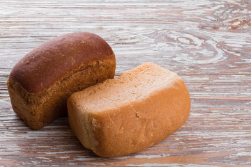 two breads on wooden background