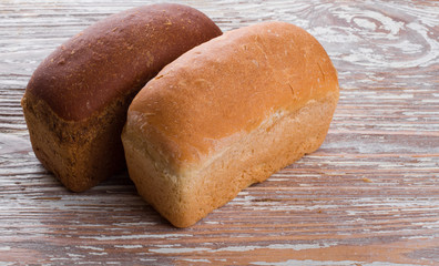 two breads on wooden background
