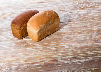 two breads on wooden background