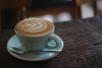 cup of coffee on wooden table