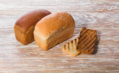breads and toasts on a wooden background