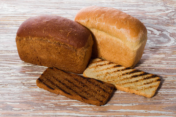 breads and toasts on a wooden background