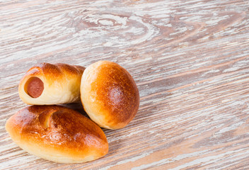 three homemade patties on a wooden background