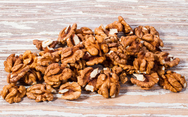walnut kernels on wooden background