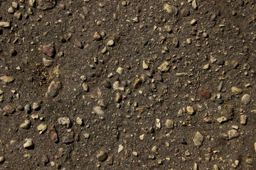 Small stones on black ground. Texture