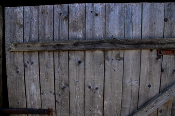 Old wooden door with hammered nails