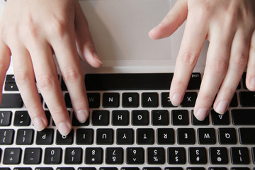 Fototapeta na wymiar woman hands on keyboard
