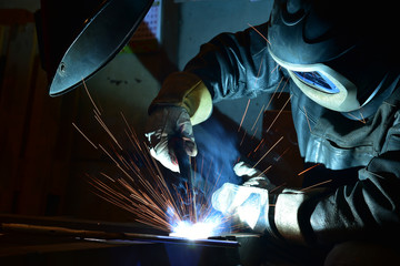 Industrial steel welder in factory welder, craftsman