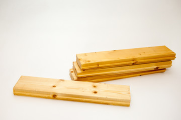 pile of pine boards for the floor device. Floor Board on white background. Decking