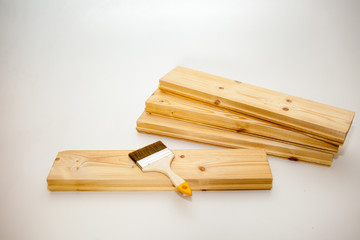 brush to paint on a wooden Board
