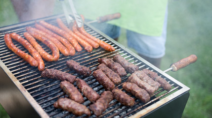 Delicious assorted grilled meat with vegetables over the coals on barbecue