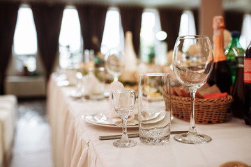 Glass glasses on the table. wine restaurant serving romance beautiful concept alcohol glass, holiday dinner in a cafe