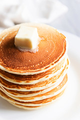 fresh classic pancake stacked in stack on gray background with place for text