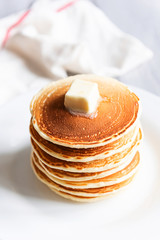 fresh classic pancake stacked in stack on gray background with place for text