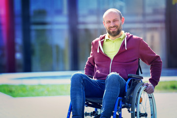 happy man on wheelchair - 259107610